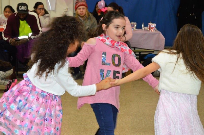 Students dancing at the family Valentine's Day Dance
